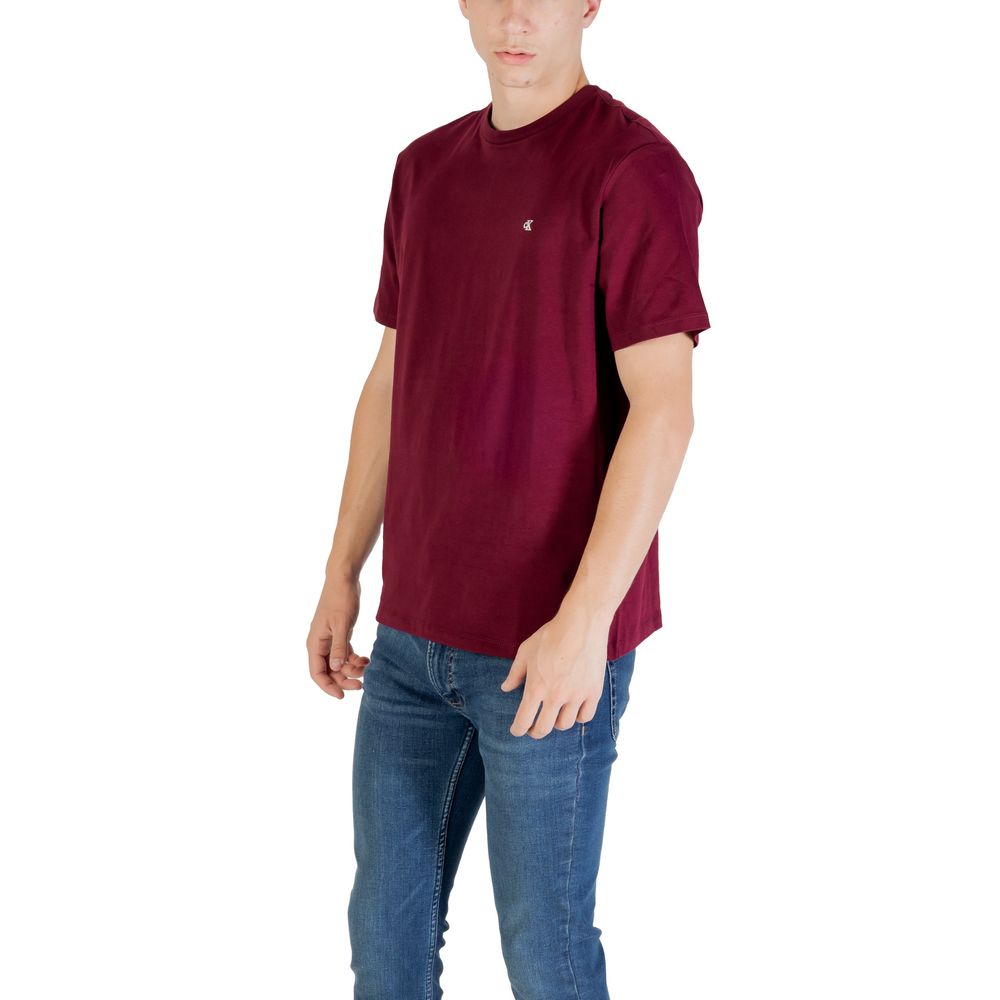 A mannequin wearing a maroon cotton t-shirt with a small white logo on the left chest