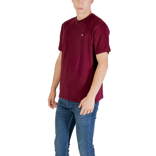 A mannequin wearing a maroon cotton t-shirt with a small white logo on the left chest