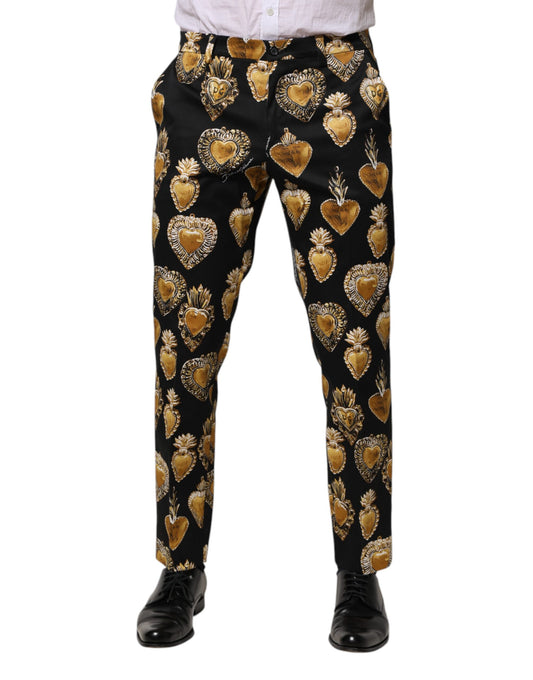 Pantalones con estampado de corazón sagrado en dorado y negro de Dolce &amp; Gabbana