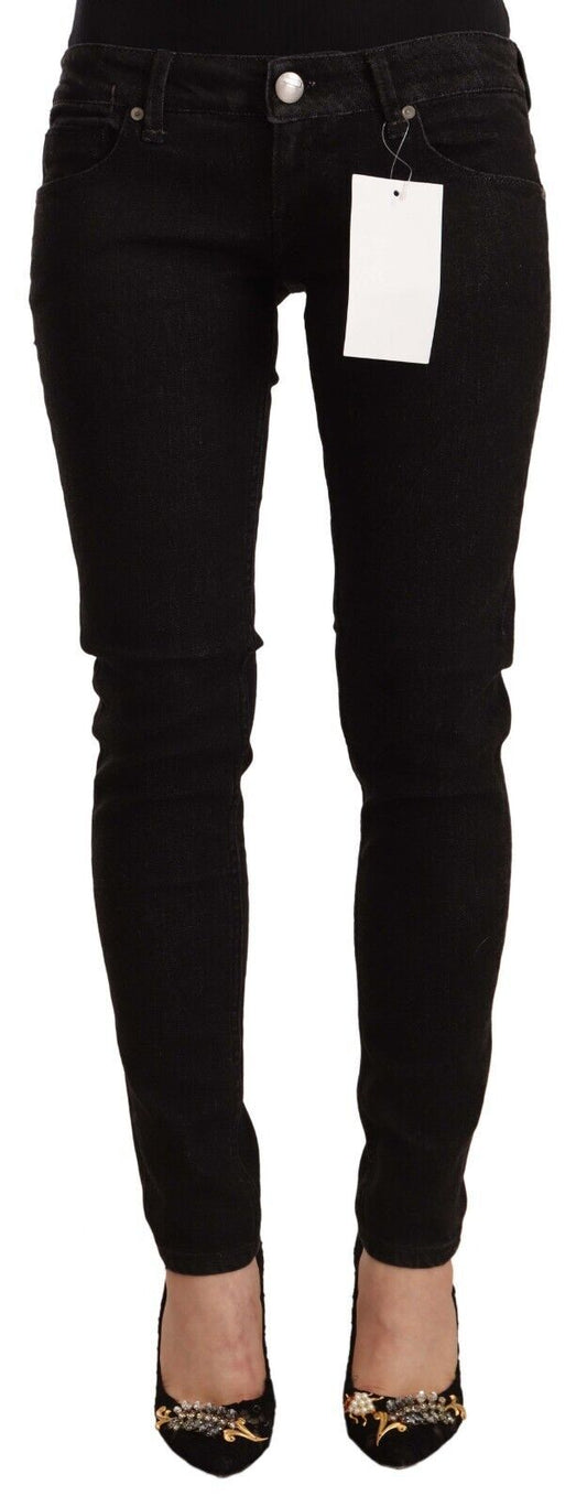 Pair of black skinny jeans with a tag on the waistband