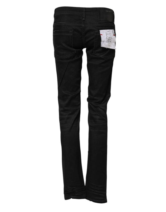 Pair of black denim jeans with visible stitching details