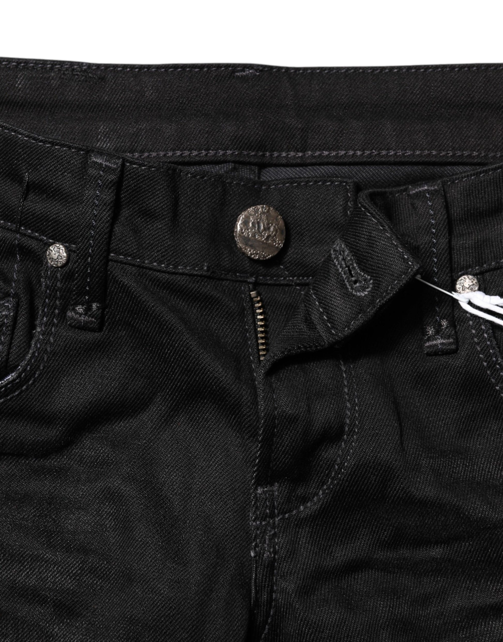 Pair of dark blue jeans with button closure