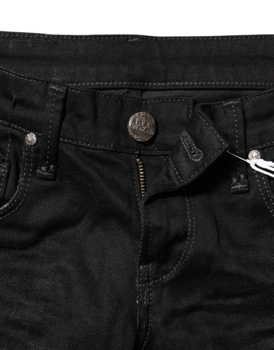 Pair of dark blue jeans with button closure