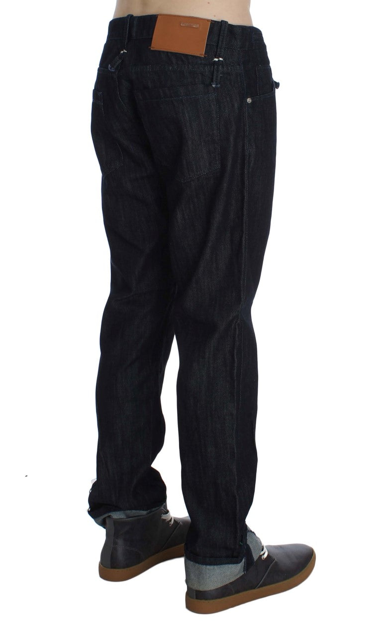 Pair of dark blue jeans with brown belt loops