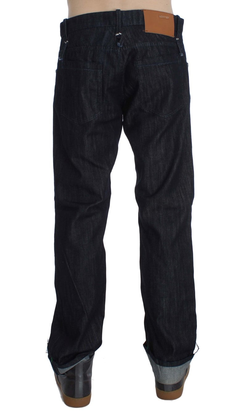 Pair of dark blue jeans with brown belt loops