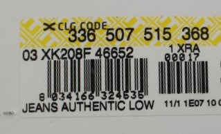 Yellow label on clothing item with barcode and serial number