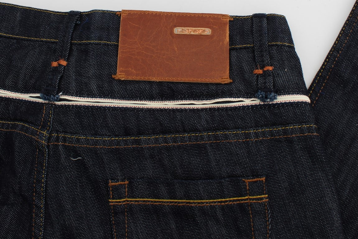 Pair of blue jeans with brown leather patch on waistband