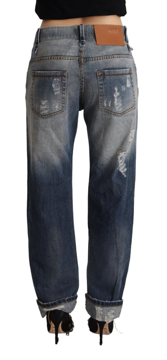 Pair of blue denim jeans with distressed areas