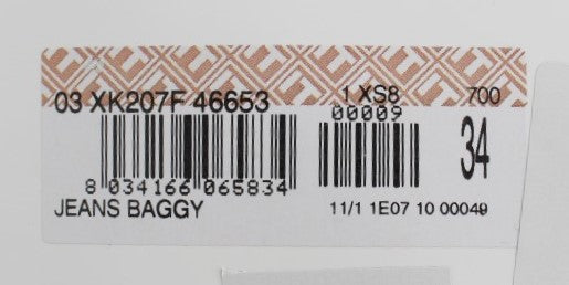 White label on clothing item with black barcode and serial number