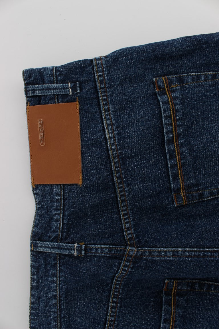 Pair of blue jeans with brown leather patch on back pocket