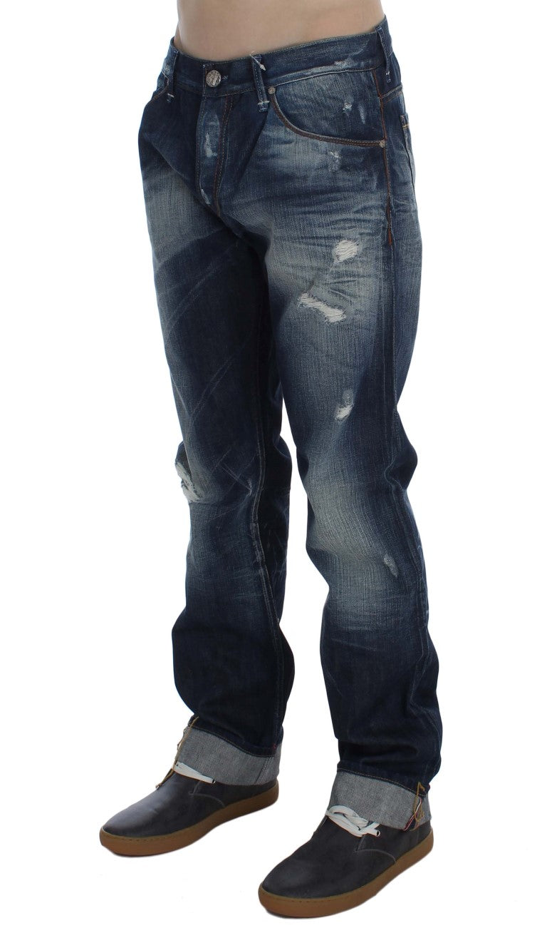 Pair of blue denim jeans with distressed areas