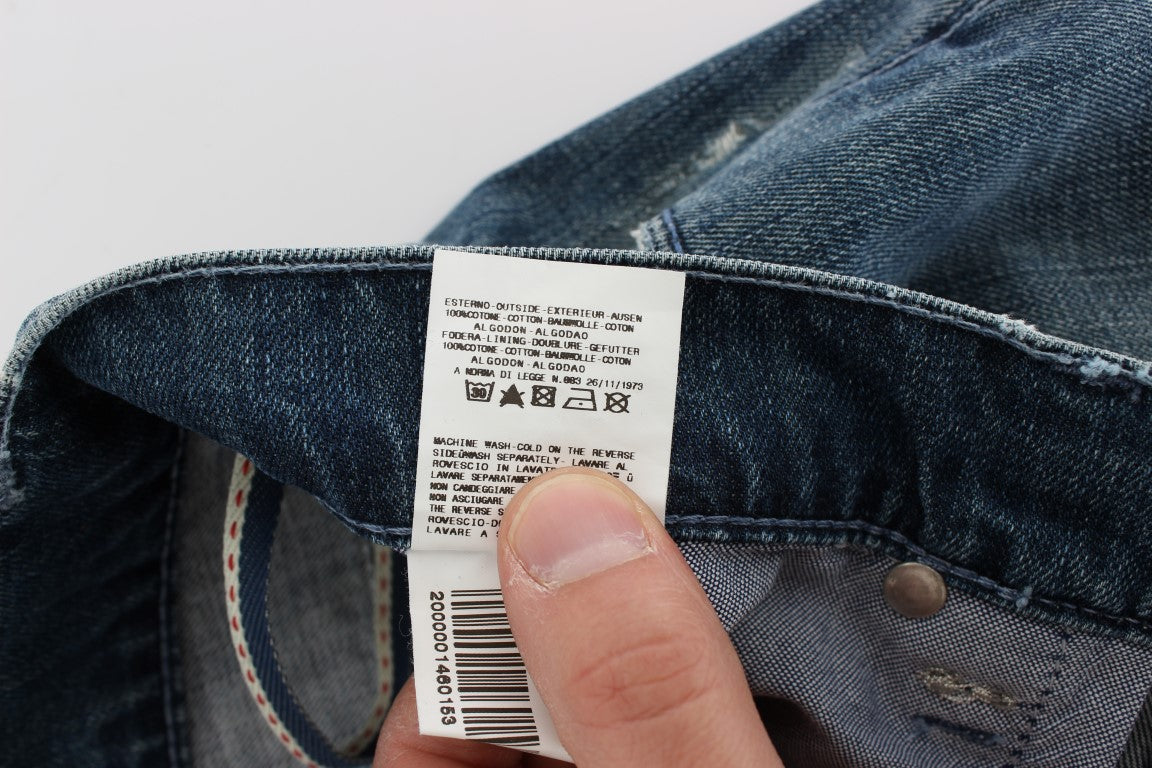 Hand holding a jeans tag