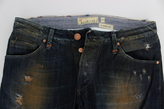 Pair of distressed blue jeans with button closure