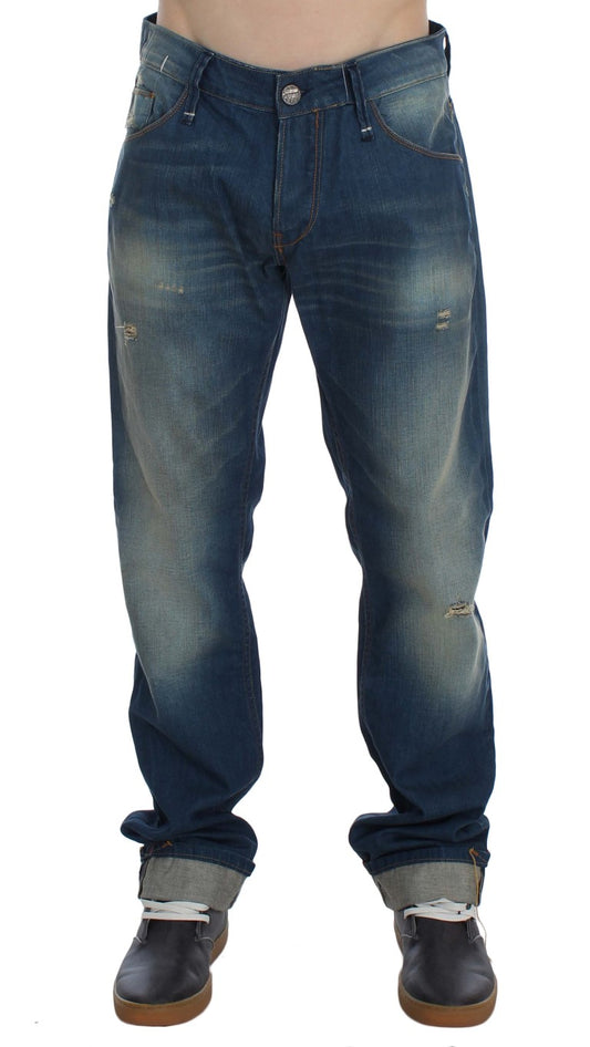 Pair of blue jeans with faded areas and pockets