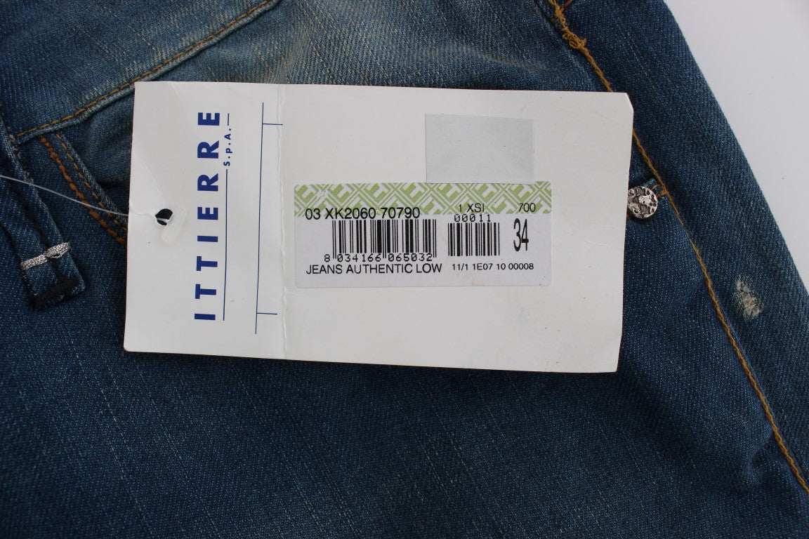 Blue jeans with white tag attached to waistband