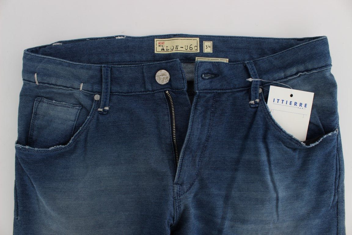 Blue denim jeans on a white surface