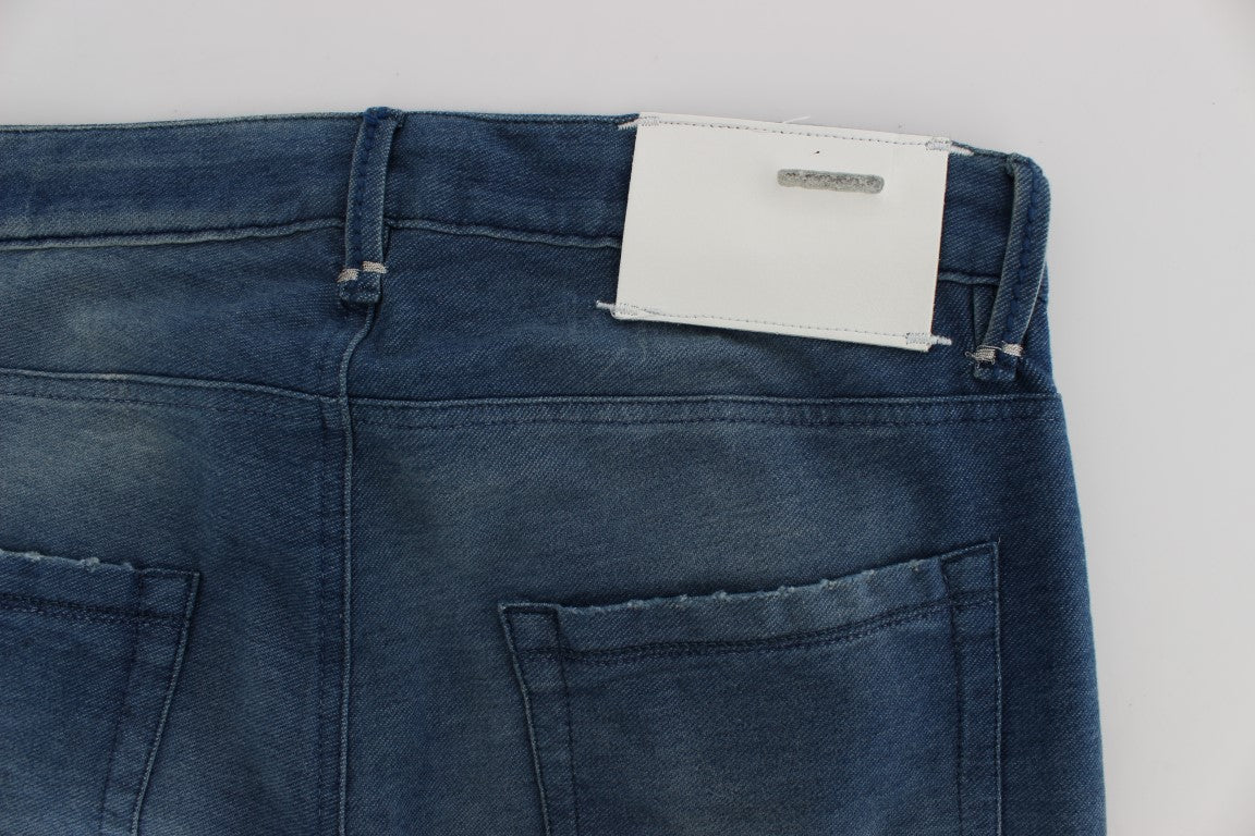 Blue denim jeans with white tag on waistband