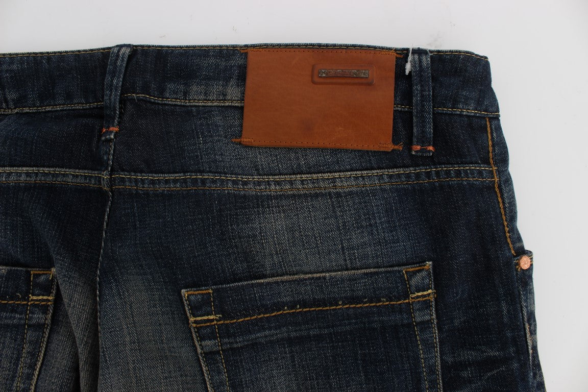 Pair of blue jeans with brown leather patch on back pocket