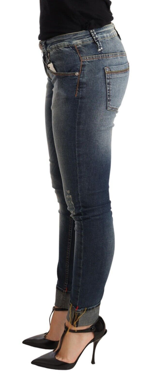 Woman wearing blue jeans and black high heels