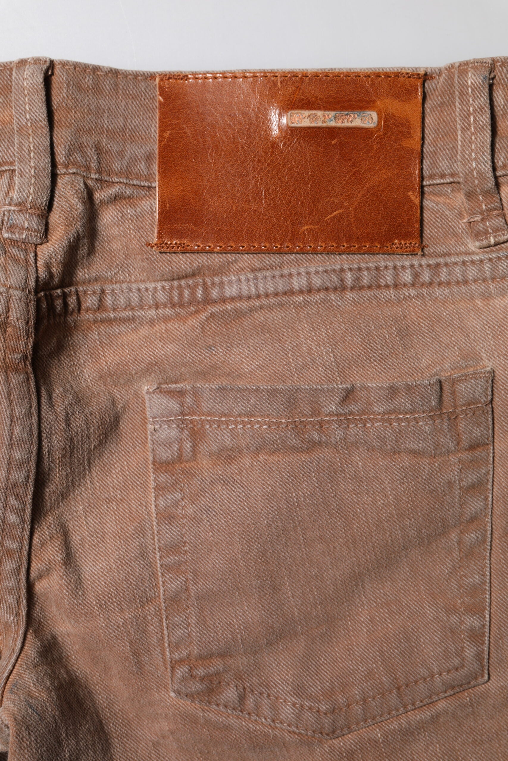 Brown denim jeans with leather patch on back pocket