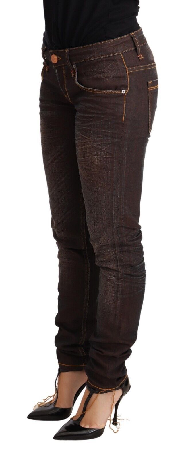 Woman wearing brown jeans and black shoes