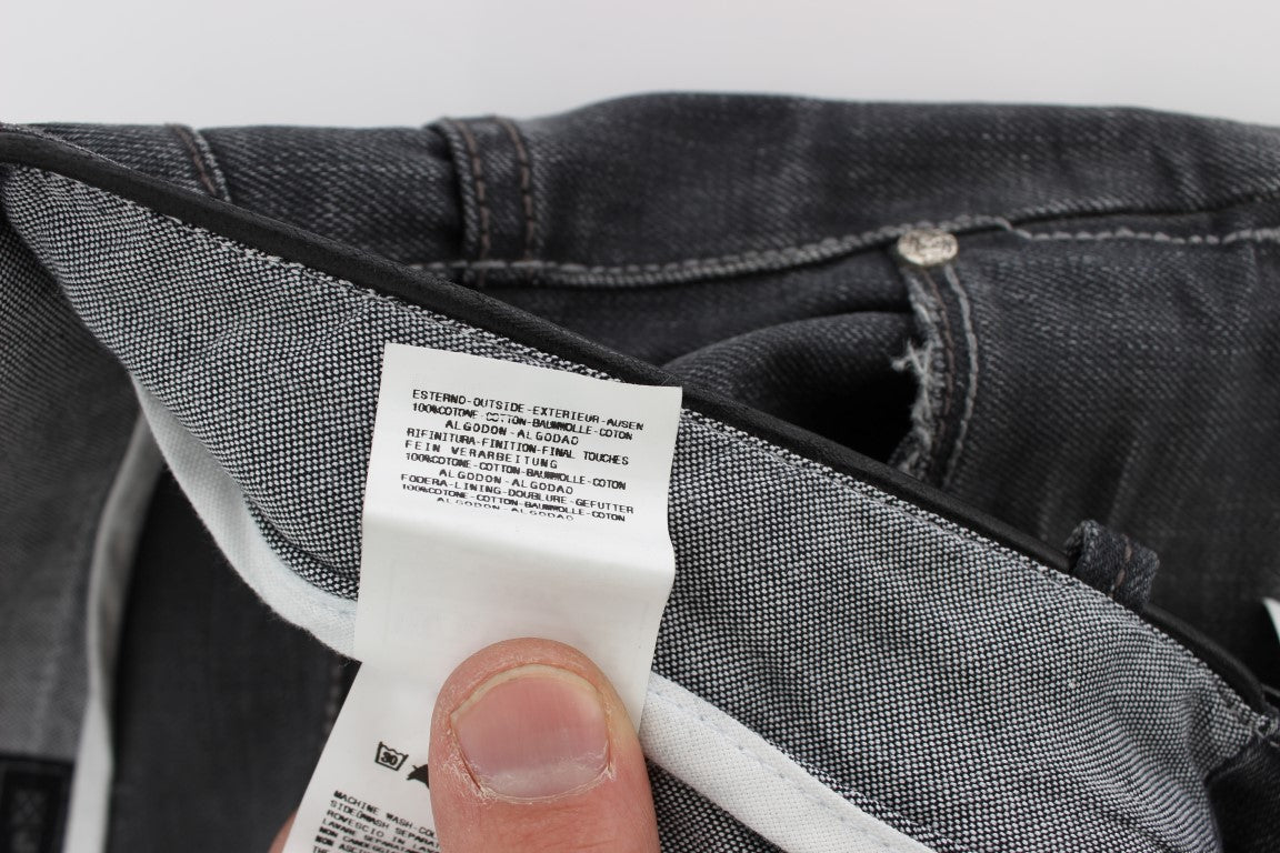 Hand holding a tag on jeans