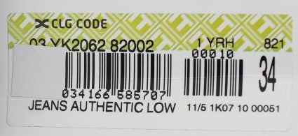 Yellow label on jeans with black barcode and white text