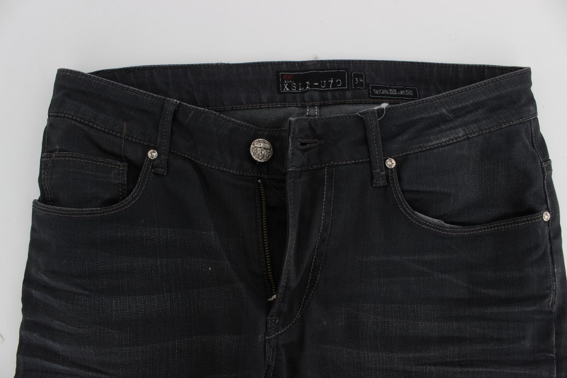 Pair of dark blue denim jeans with zipper fly and buttoned waistband