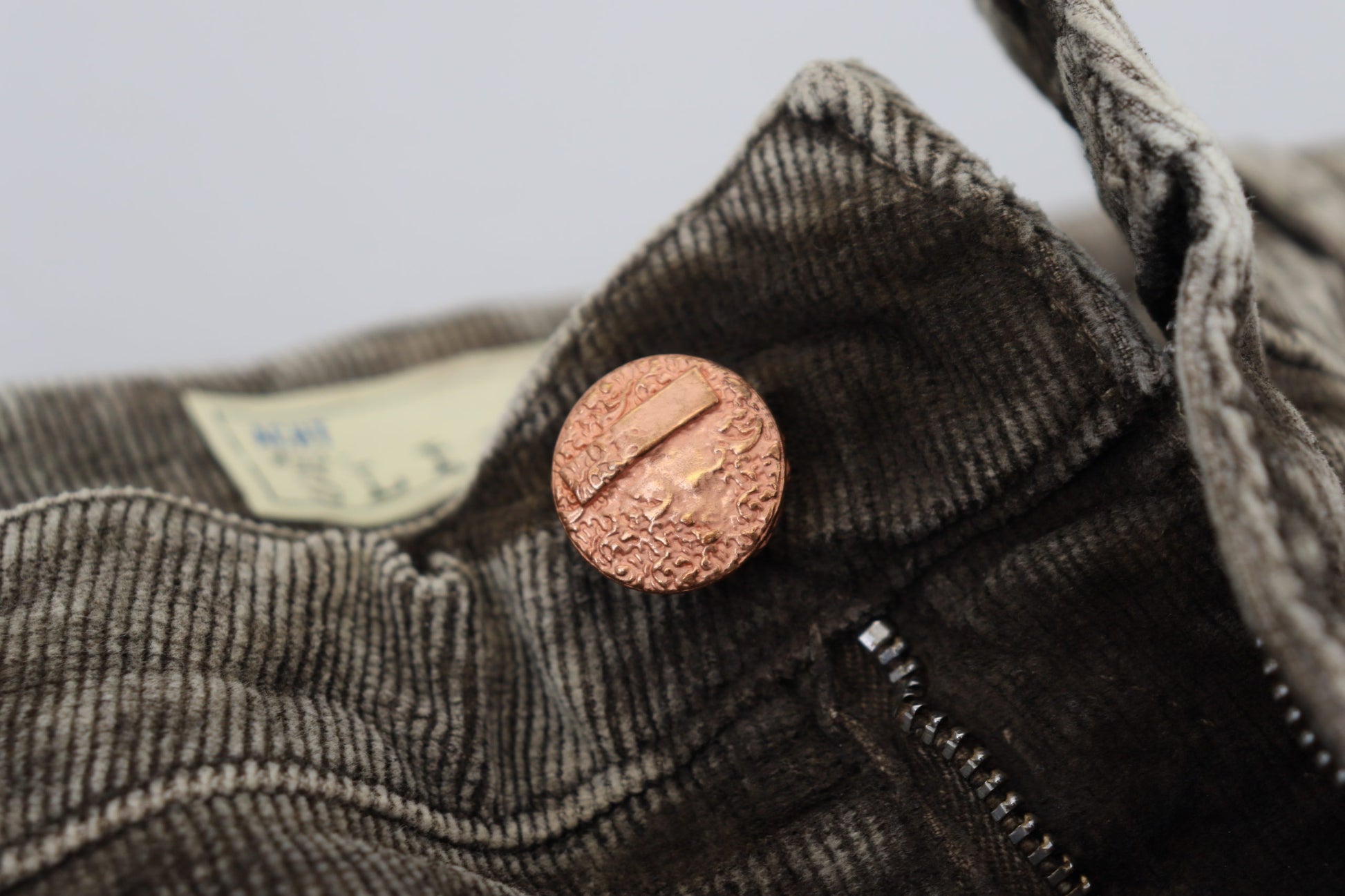 Copper button on jacket