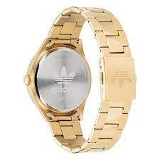 A gold stainless steel watch with a black face featuring the Adidas logo