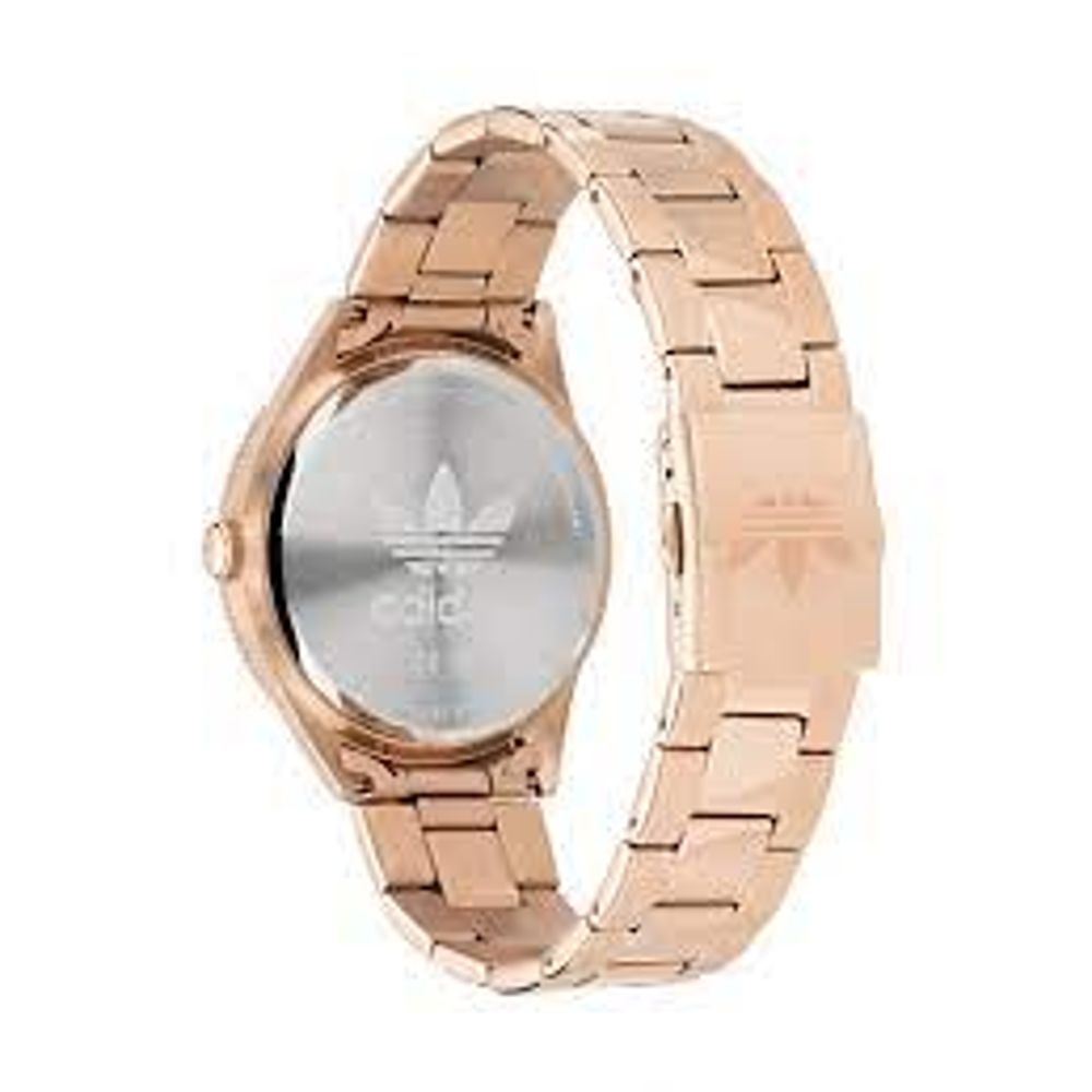 A copper rose gold watch with a white face featuring an adidas logo