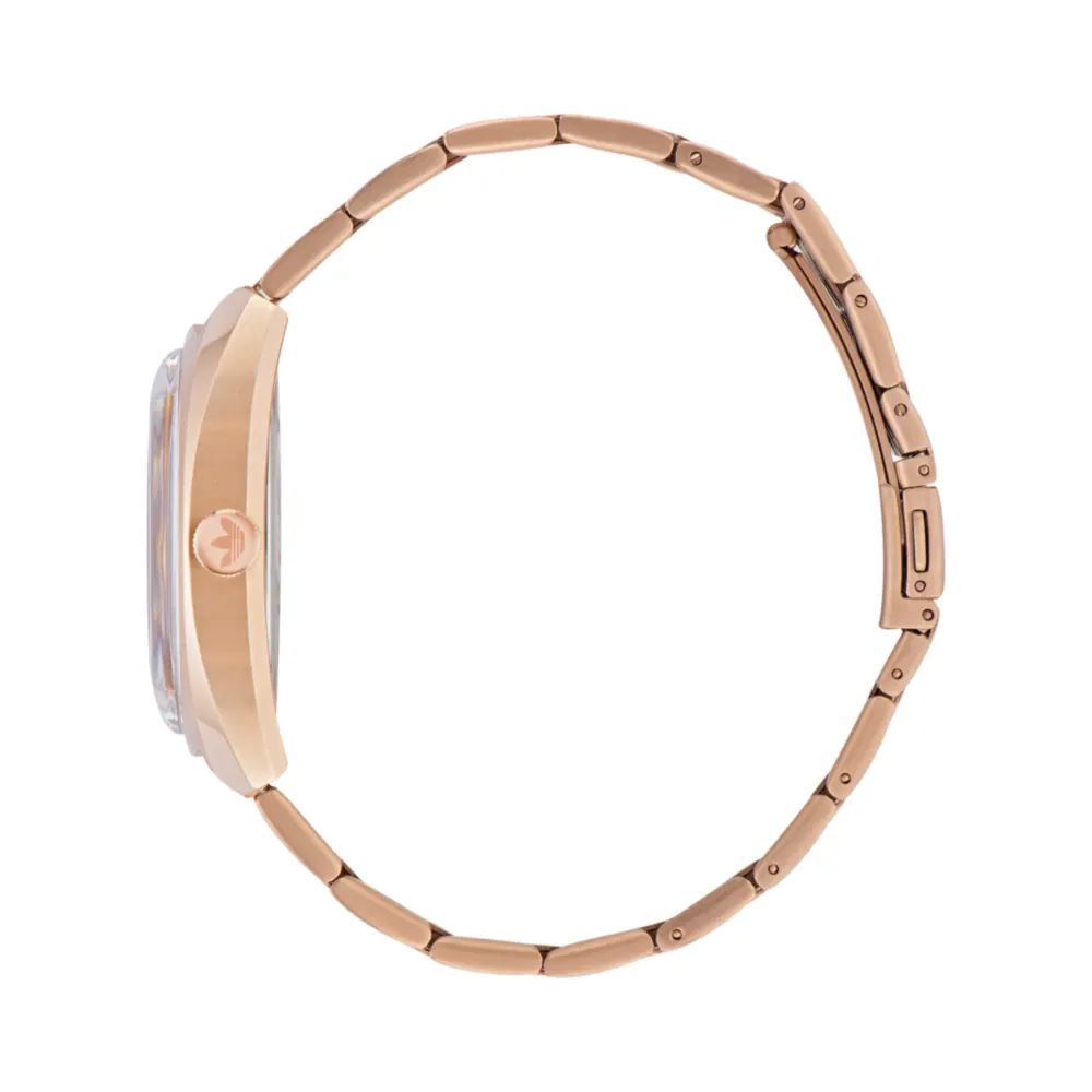 A rose gold watch with a stainless steel band and a white face