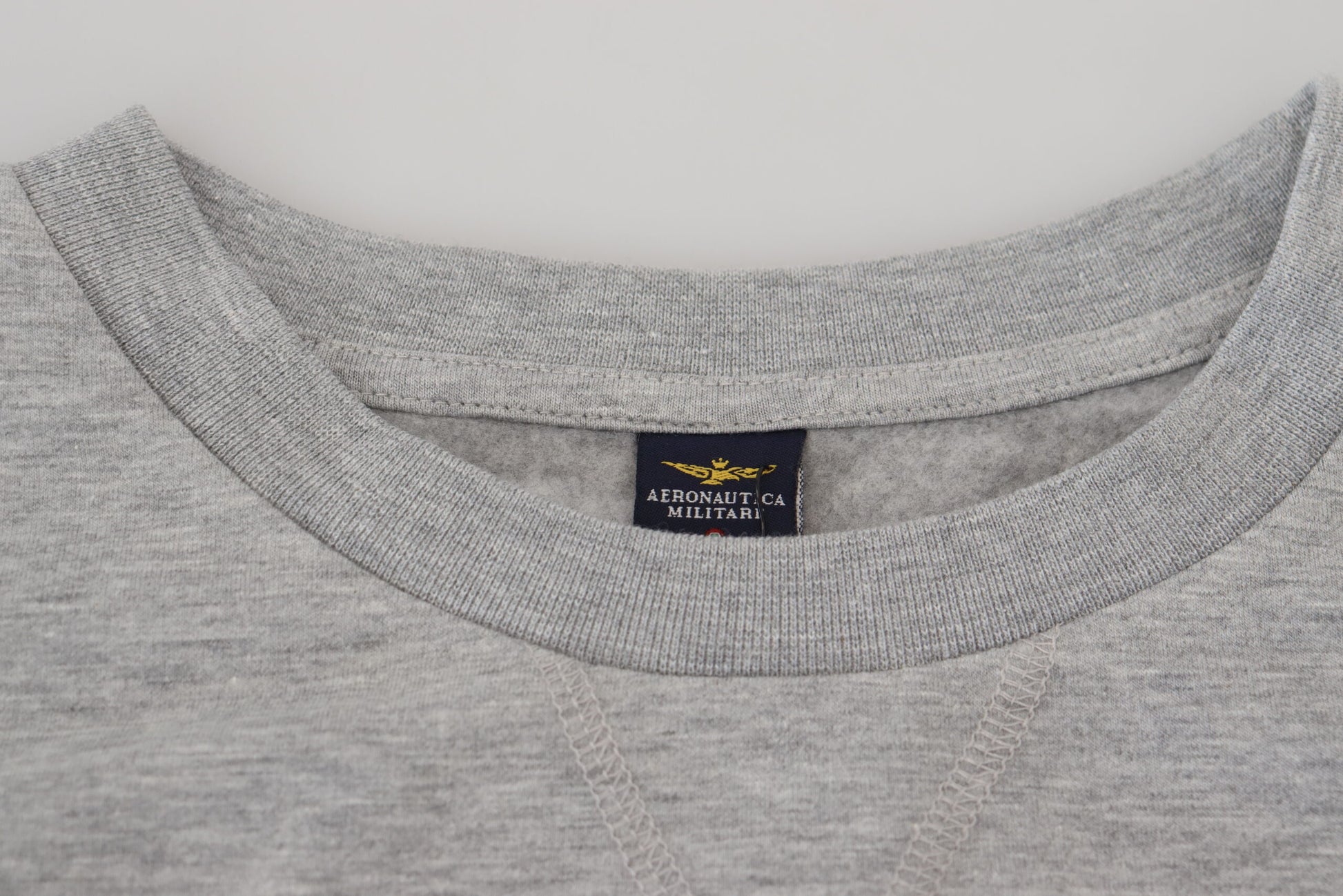 Grey long sleeve shirt with a V neckline