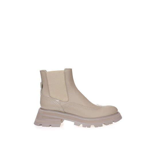 Tan leather boot with laces and a small heel