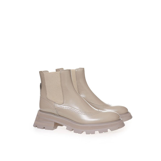 Tan waterproof boot with laces and a visible logo on the side