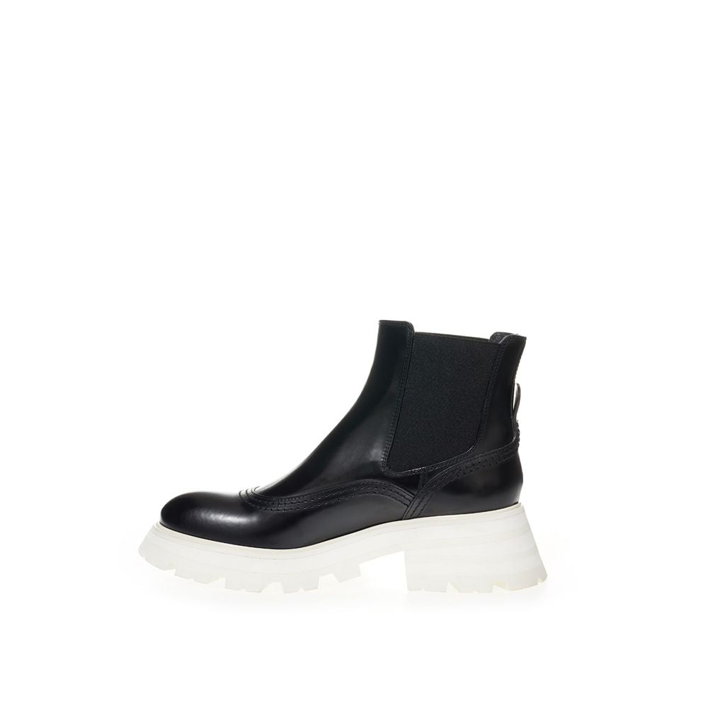 Black ankle boot with chunky sole and lace up front