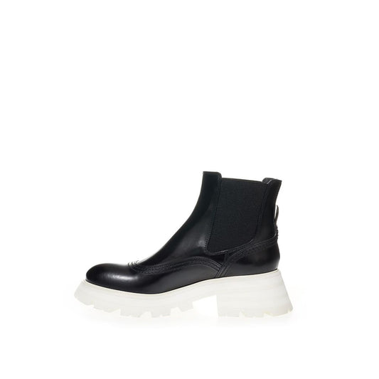 Black ankle boot with chunky sole and lace up front