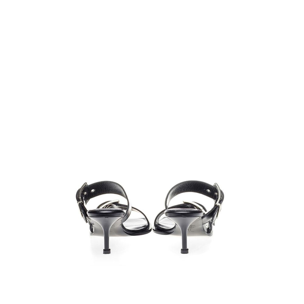 Pair of black high heel shoes with straps and buckles
