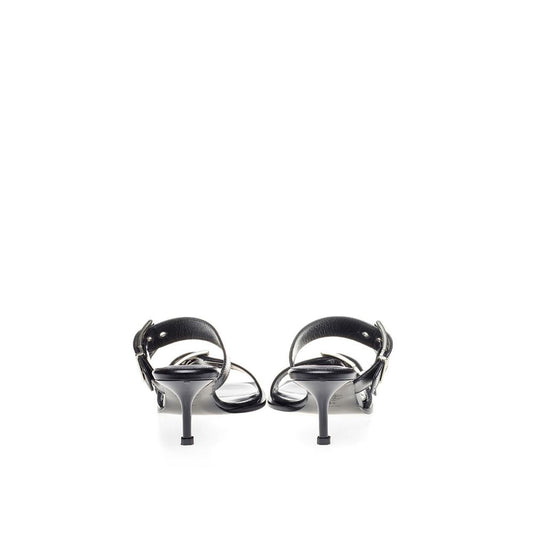 Pair of black high heel shoes with straps and buckles
