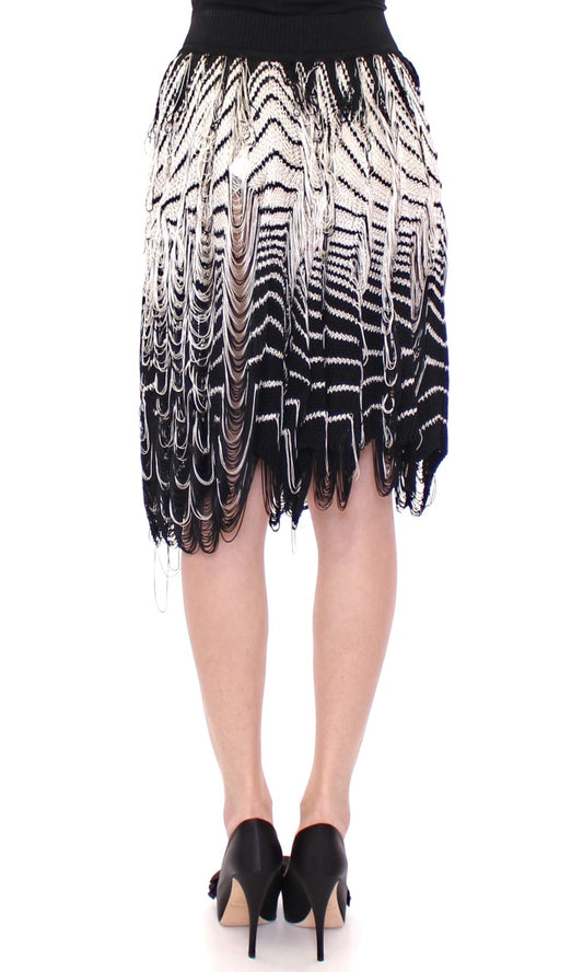 Black and white fringe skirt worn by a woman