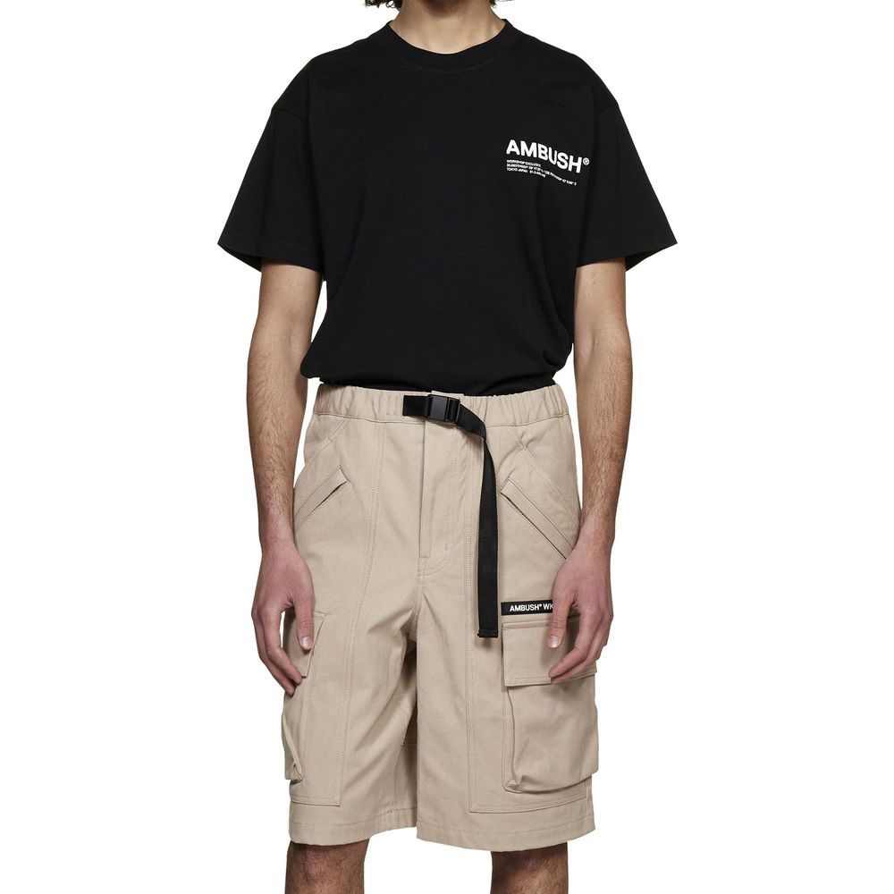 Man wearing black t-shirt and khaki cargo shorts