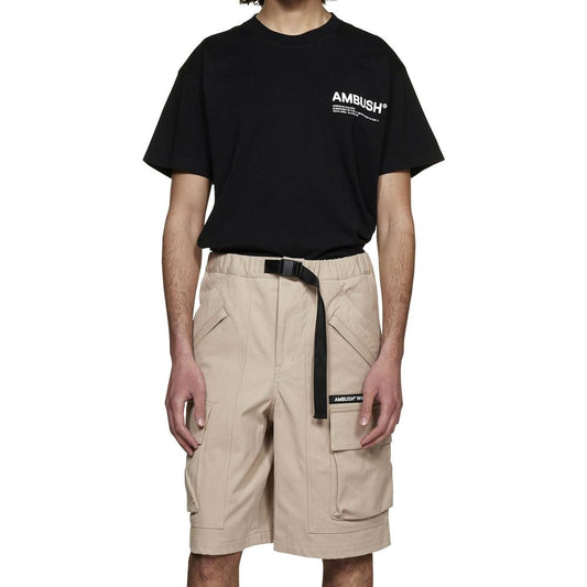 Man wearing black t-shirt and khaki cargo shorts