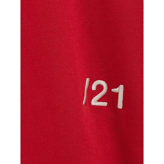 Red jersey with white number 121 on sleeve