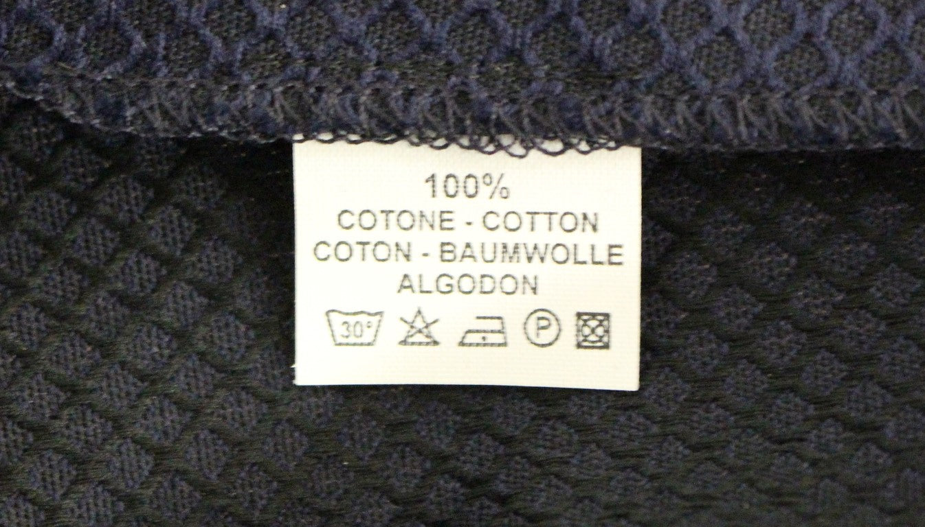 Blue fabric with white label indicating cotton content