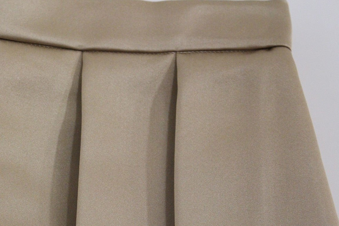 Tan fabric curtains with visible seams and ties