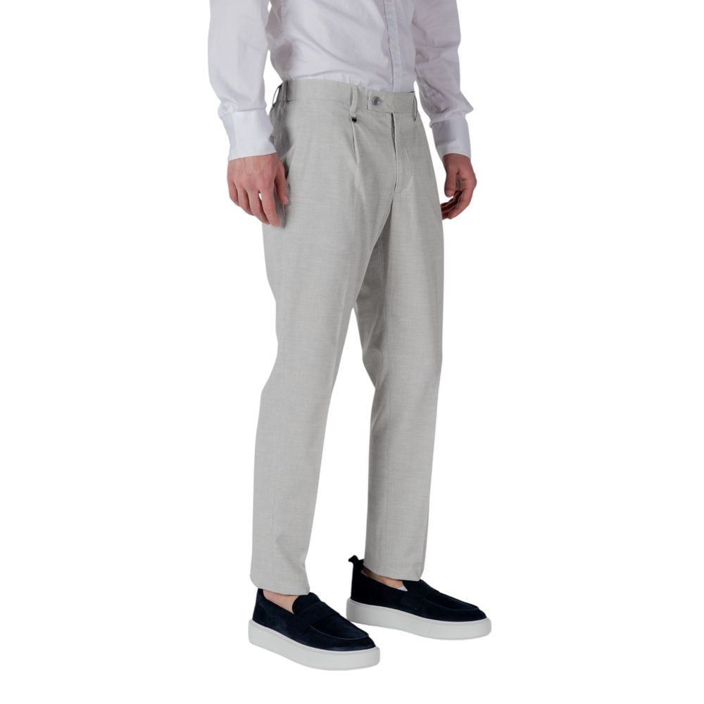 A pair of gray polyester dress pants from the brand Antony Morato. They are designed with a slim fit and feat