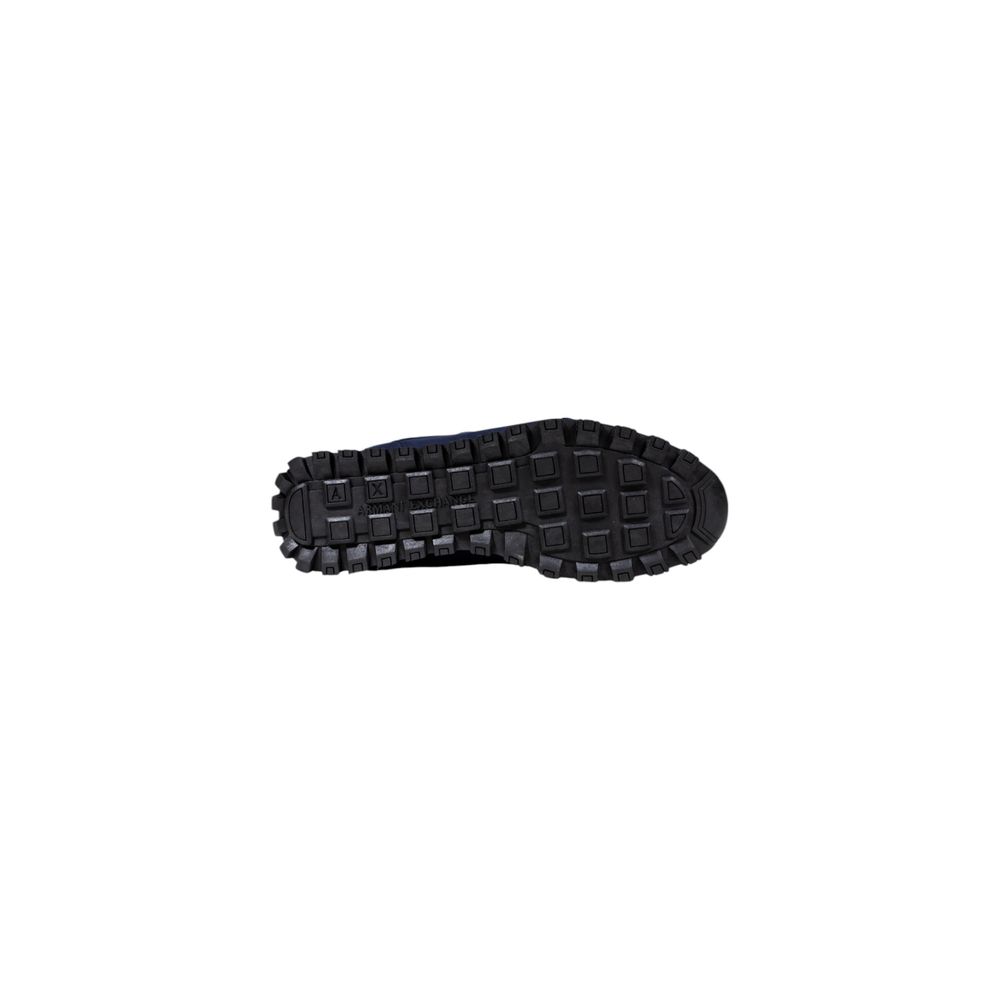 Black and white athletic sneaker with a bicolor design, featuring polyester material