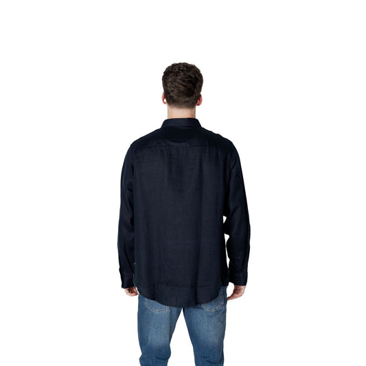 A mannequin wearing a blue linen dress shirt from Armani Exchange