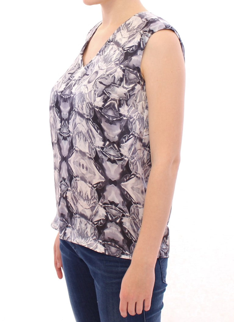 Woman wearing a sleeveless top with a patterned design