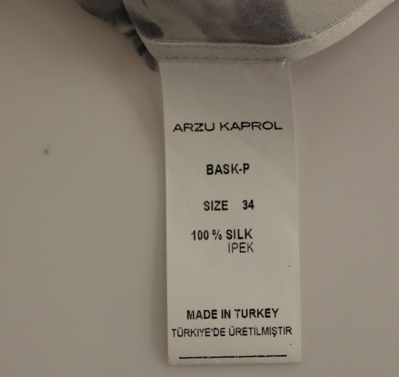 Tag on a piece of clothing indicating size, material, and country of manufacture